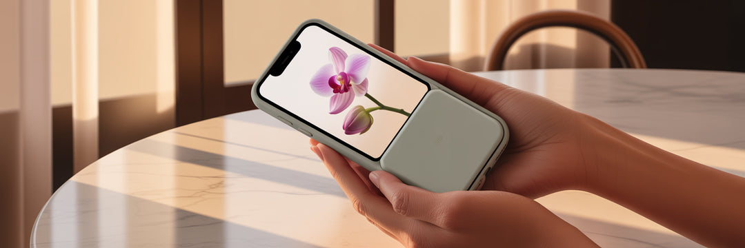 Woman holding iPhone with stylish case.