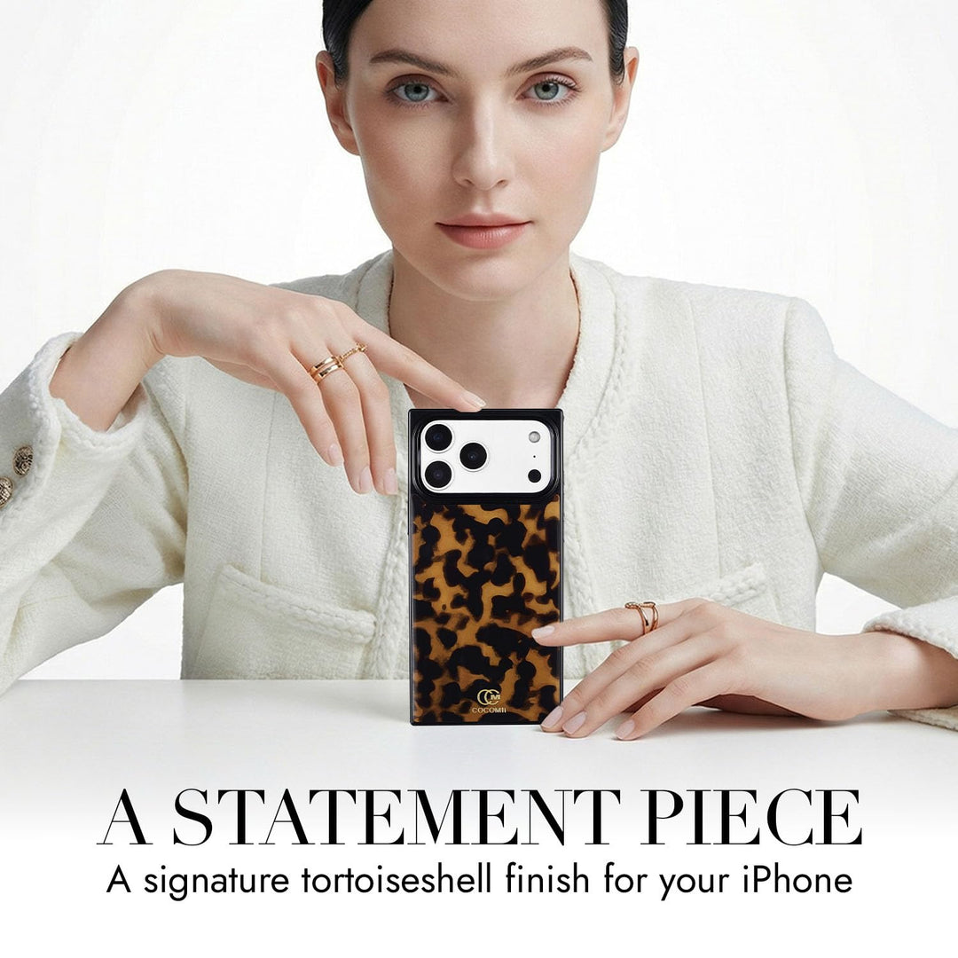 COCOMII tortoiseshell-pattern MagSafe iPhone case in Chestnut - held up on a table as a statement piece