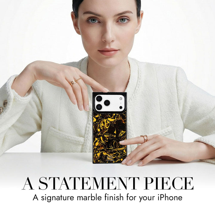 COCOMII marble-pattern MagSafe iPhone case in Molten - held up on a table as a statement piece