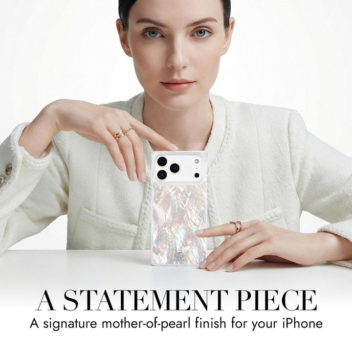 COCOMII mother of pearl MagSafe iPhone case in Natural - held up on a table as a statement piece