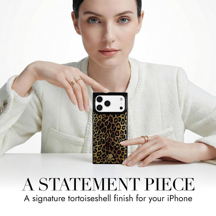 COCOMII leopard print MagSafe iPhone case in Amber - held up on a table as a statement piece